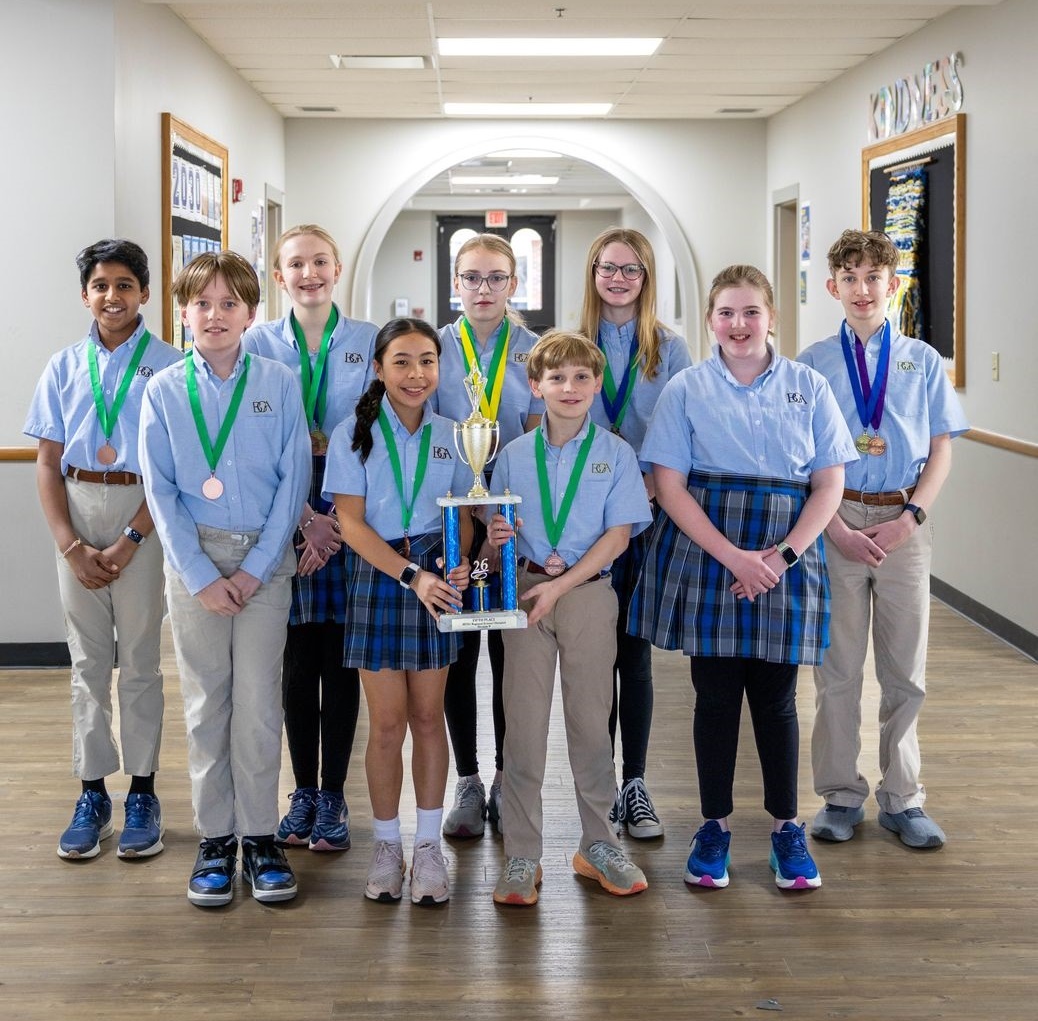 photo of students with trophy